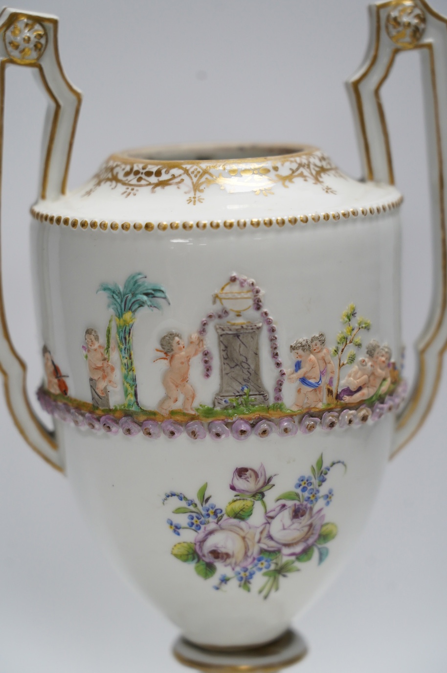 A Capodimonte / Naples style urn, early 19th century 26cm. Condition - poor (base cracked)